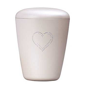 Perlehvit urne fra Jølstad begravelsesbyrå