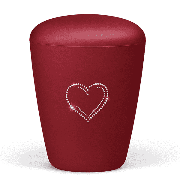 Rød urne med hjertemotiv fra Jølstad begravelsesbyrå